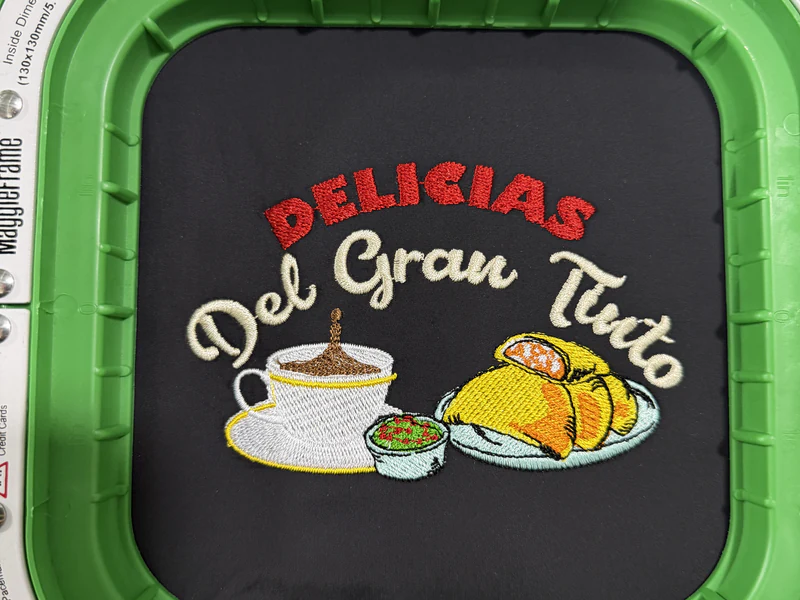 Logo de Delicias del Gran Tinto terminado en el bastidor