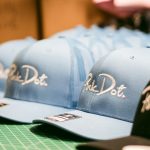 a row of hats sitting on top of a table